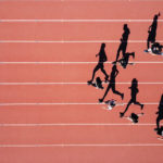 Photo of athletes running in stadium
