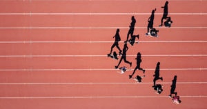 Photo of athletes running in stadium