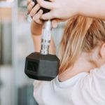 Photo of woman lifting weight in gym in San Pedro Today magazine